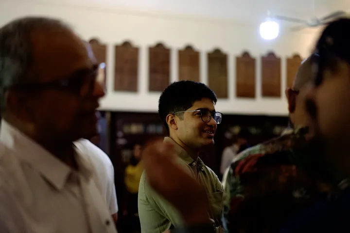 Guests talking together during the Kerala Origins Kochi gathering.